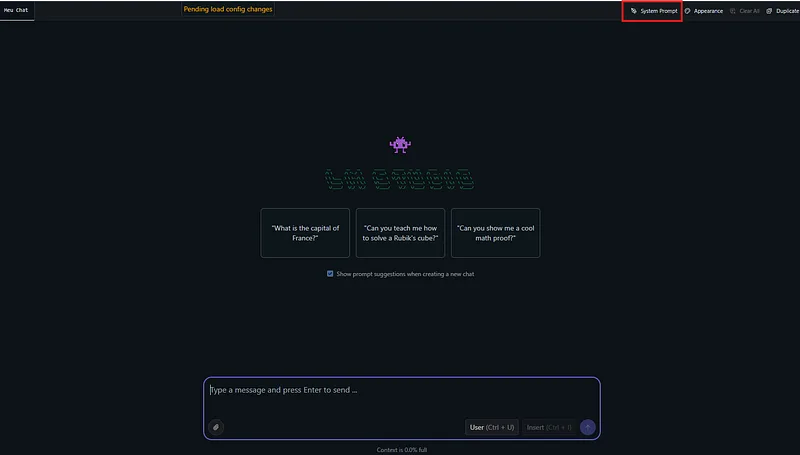 Tela de chat do LM Studio com o botão System Prompt destacado em vermelho no canto superior direito e três sugestões de pergunta no centro.